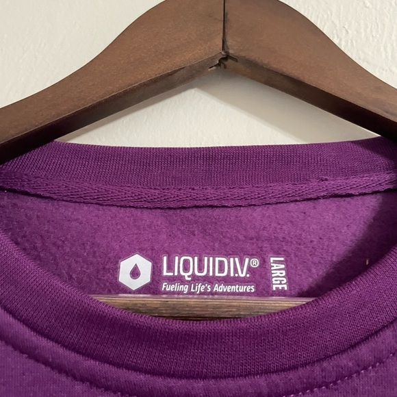 Liquid IV Purple Crew Neck Pull Over Hydration Sweatshirt - Picture 3 of 3
